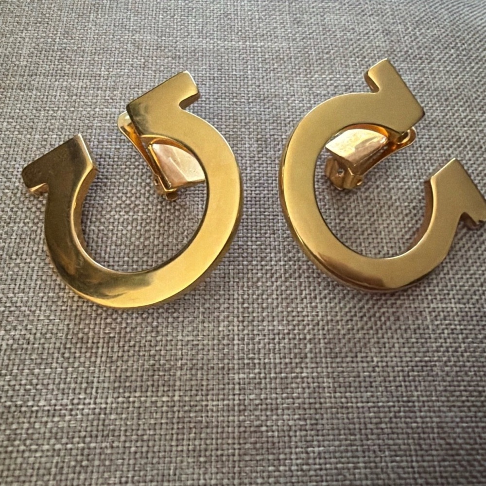 Salvatore Ferragamo Gancini Gold Tone Clip-On Earrings.